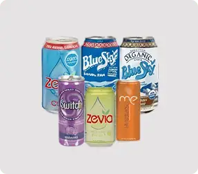 Assorted beverage cans on a light background.