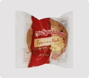 Banana nut muffin in plastic packaging.