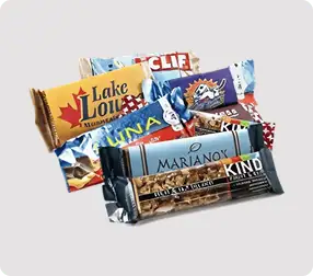 Assorted energy bars in colorful packaging.